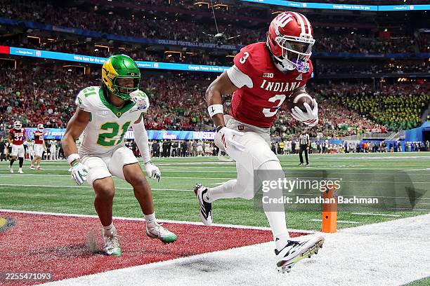 Omar Cooper Jr. #3 of the Indiana Hoosiers catches a pass for a touchdown against Aaron Flowers of the Oregon Ducks during the first quarter in the...