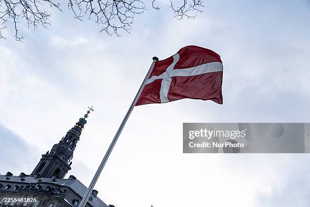 Danish flag flutters outside Christiansborg Palace in Copenhagen, Denmark, on January 9, 2026.