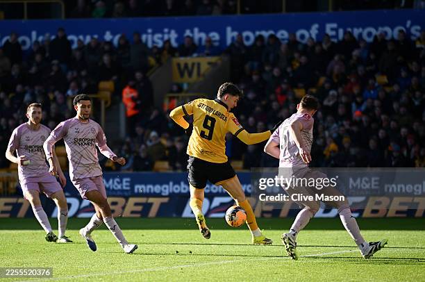 Joergen Strand Larsen of Wolverhampton Wanderers scores his team's first goal during the Emirates FA Cup Third Round match between Wolverhampton...