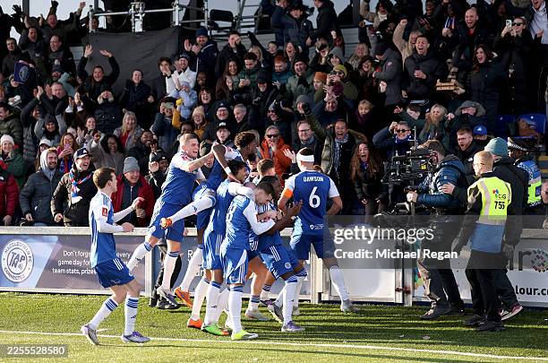 Isaac Buckley-Ricketts of Macclesfield celebrates scoring his team's second goal with teammates during the Emirates FA Cup Third Round match between...