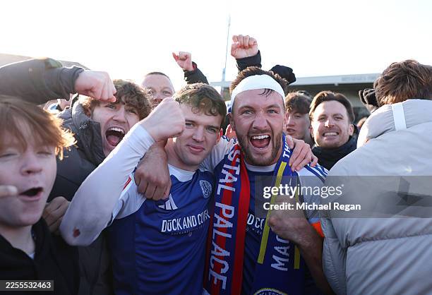 Paul Dawson of Macclesfield celebrates with fans after the team's victory following the Emirates FA Cup Third Round match between Macclesfield and...