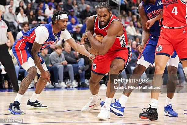 Kawhi Leonard of the Los Angeles Clippers grabs a rebound during the second quarter of a game against the Detroit Pistons at Little Caesars Arena on...
