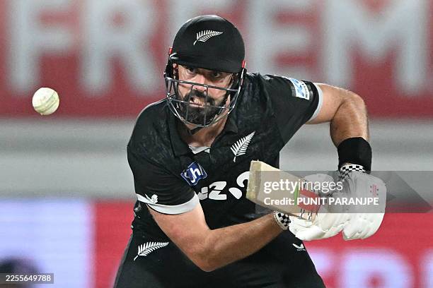New Zealand's Daryl Mitchell plays a shot during the second one-day international cricket match between India and New Zealand at Niranjan Shah...