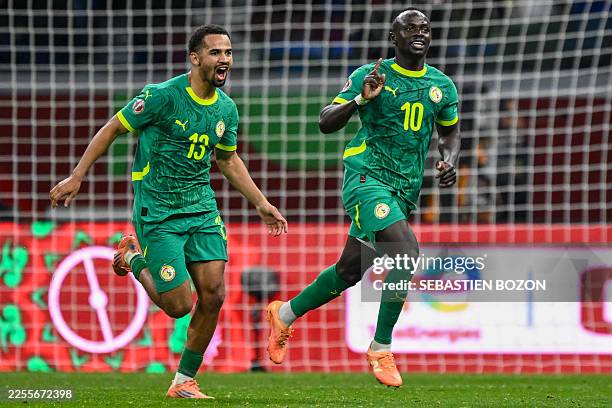 Senegal's forward Sadio Mane celebrates his goal with Senegal's forward Iliman Ndiaye during the Africa Cup of Nations semi-final football match...