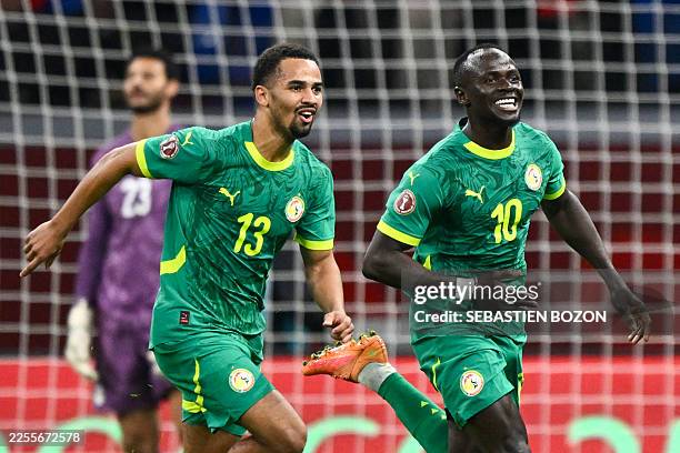 Senegal's forward Sadio Mane celebrates his goal with Senegal's forward Iliman Ndiaye during the Africa Cup of Nations semi-final football match...