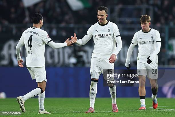 Haris Tabakovic of Borussia Monchengladbach celebrates with teammate Kevin Diks after scoring his team's fourth goal during the Bundesliga match...