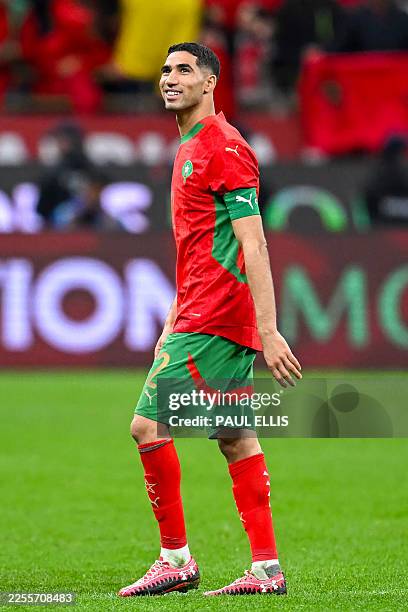 Morocco's defender Achraf Hakimi celebrates after the Africa Cup of Nations semi-final football match between Nigeria and Morocco at the Prince...