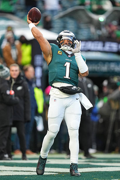 Jalen Hurts of the Philadelphia Eagles warms up before the NFC Wild Card Playoff game against the San Francisco 49ers at Lincoln Financial Field on...