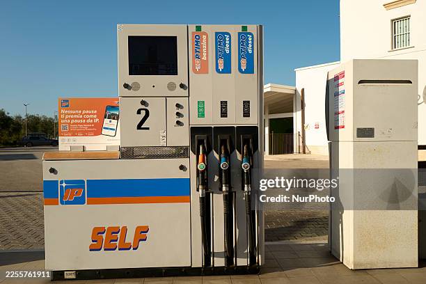 Digital display on an IP brand fuel pump shows pricing and ''Self'' service instructions in Bari, Italy, on January 4, 2026.