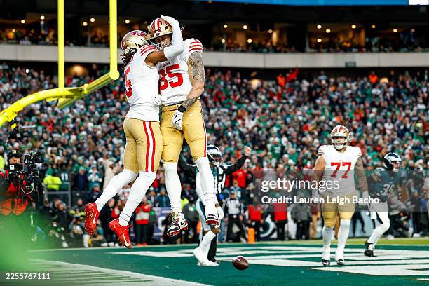 Demarcus Robinson and George Kittle of the San Francisco 49ers celebrate during the first quarter of the NFC Wild Card playoff game against the...