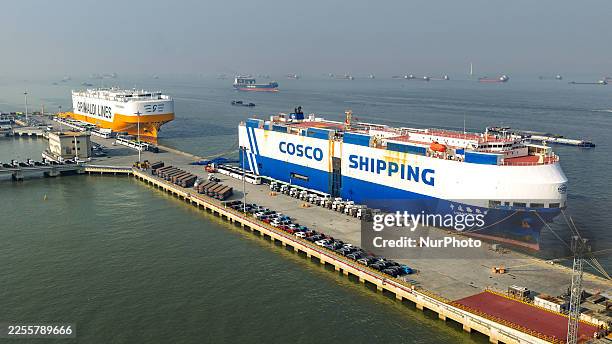 Roll-on/roll-off ship loads new energy vehicles at the Taicang Port of Suzhou Port in Suzhou, Jiangsu Province, China, on January 15, 2026.