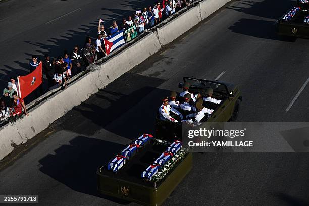 Cubans bid farewell to the funeral procession carrying the remains of the 32 Cuban soldiers who died during the US incursion to capture Venezuelan...