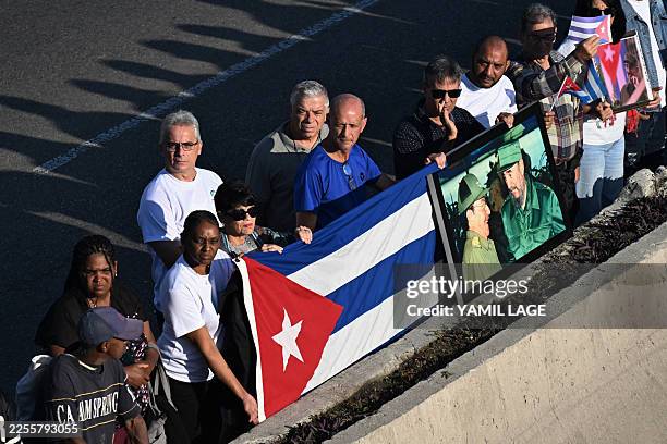 Cubans bid farewell to the funeral procession carrying the remains of the 32 Cuban soldiers who died during the US incursion to capture Venezuelan...