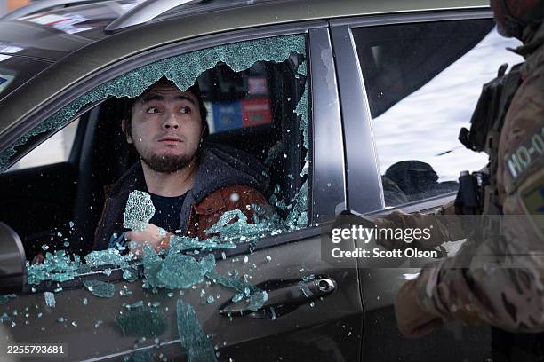 Border Patrol agents smash a man's car window before dragging him out and taking him into custody when he failed to present citizenship documentation...