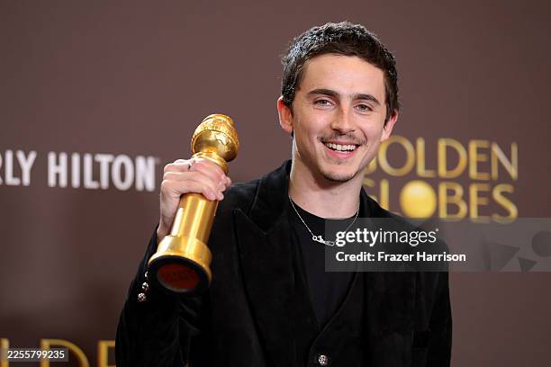 Timothée Chalamet, winner of the Best Performance by a Male Actor in a Motion Picture – Musical or Comedy award for "Marty Supreme," poses in the...