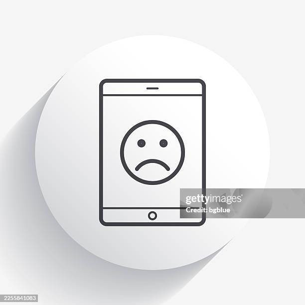 tablet pc with sad emoji. icon on circle button with long shadow - smiley face badge stock illustrations