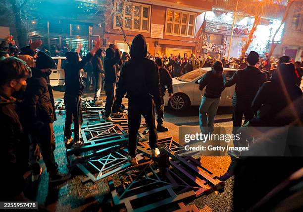 People gather during protest on January 8, 2026 in Tehran, Iran. Demonstrations have been ongoing since December, triggered by soaring inflation and...