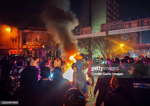 Fires are lit as protesters rally on January 8, 2026 in Tehran, Iran. Demonstrations have been ongoing since December, triggered by soaring inflation...