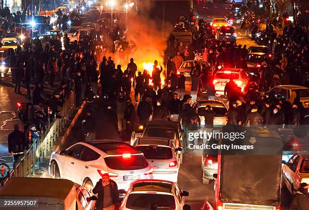 People gather during protest on January 8, 2026 in Tehran, Iran. Demonstrations have been ongoing since December, triggered by soaring inflation and...