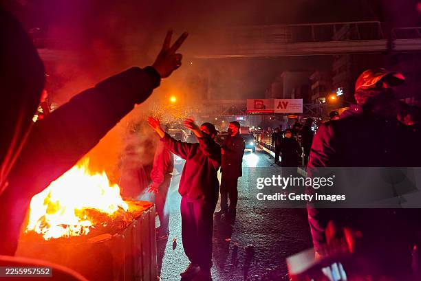 Fires are lit as protesters rally on January 8, 2026 in Tehran, Iran. Demonstrations have been ongoing since December, triggered by soaring inflation...