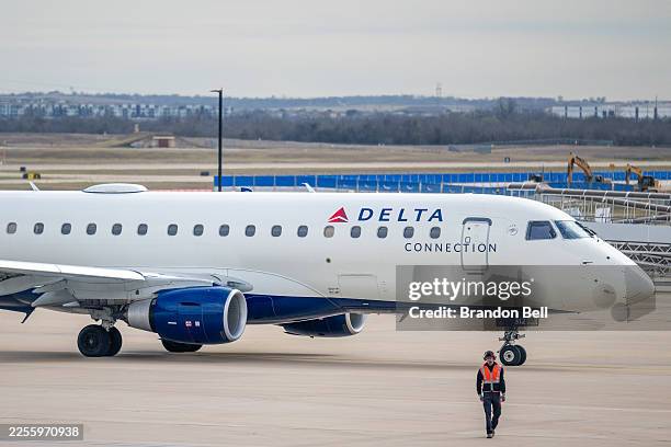 Delta Airlines plane sits on the tarmac at the Austin-Bergstrom International Airport on January 12, 2026 in Austin, Texas. Delta Airlines will...