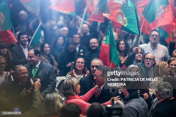 Portugal's Socialist Party presidential candidate Antonio Jose Seguro greets supporters during a rally in Lisbon on January 16, 2026. Portuguese...
