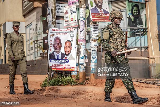 Members of Uganda's police force and the Ugandan army patrol the streets two days after the country's 2026 presidential election as vote counting...