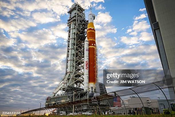S Artemis II Space Launch System rocket and Orion spacecraft are rolled out of the Vehicle Assembly Building to Launch Pad 39B at Kennedy Space...