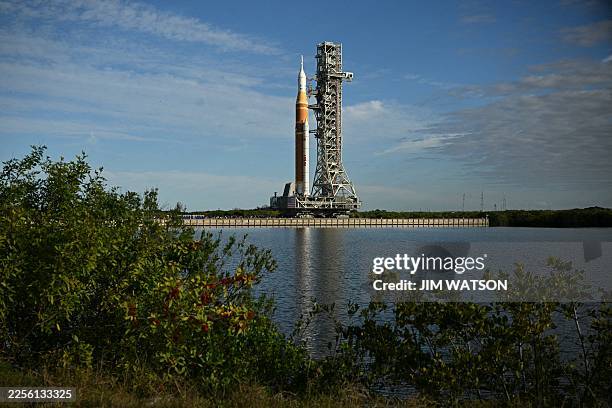 S Artemis II Space Launch System rocket and Orion spacecraft are rolled out of the Vehicle Assembly Building to Launch Pad 39B at Kennedy Space...