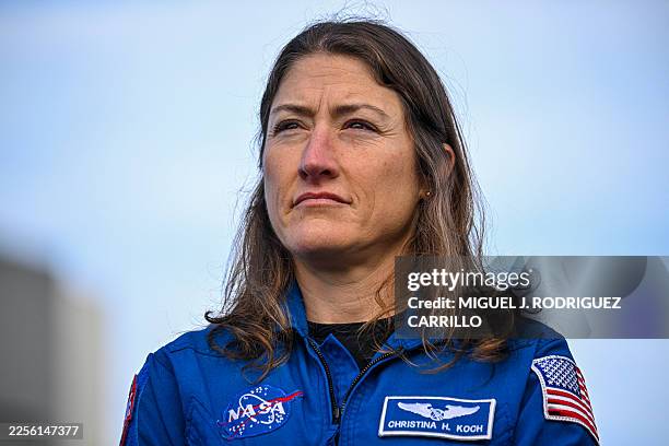 Astronaut and Artemis II Mission Specialist Christina Koch, looks on during the rollout of NASA's next-generation moon rocket, the Space Launch...