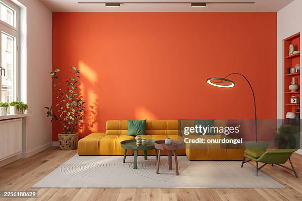 stylish modern living room featuring warm tones and minimalist design - imagem a cores imagens e fotografias de stock