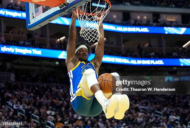 Jimmy Butler III of the Golden State Warriors slam dunks against the Portland Trail Blazers in the second half at Chase Center on January 13, 2026 in...
