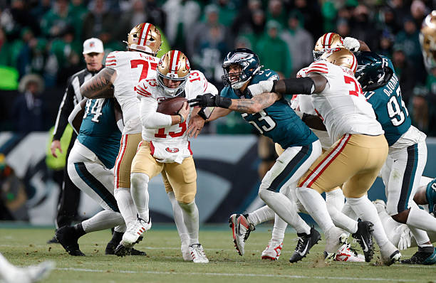 Brock Purdy of the San Francisco 49ers scrambles during the NFC Wild Card playoff game against the Philadelphia Eagles at Lincoln Financial Field on...