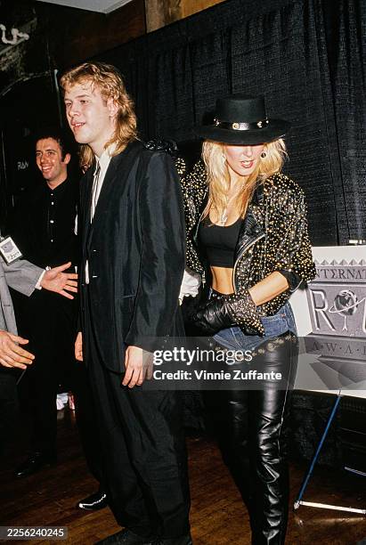 Canadian singer, songwriter and guitarist Jeff Healey, wearing a black suit with a bolo tie, and American singer, songwriter and guitarist Lita Ford,...