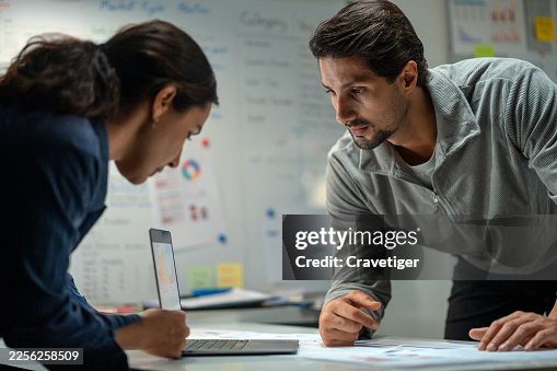 Software Developers Exchanging Expertise on Python AI Project. Software Developers Exchanging Expertise on Python AI Project.