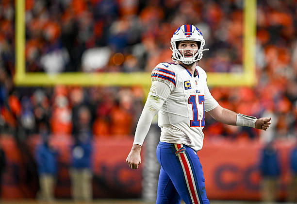 Josh Allen of the Buffalo Bills reacts to throwing an interception to Ja'quan McMillian of the Denver Broncos during overtime of the Broncos' 33-30...