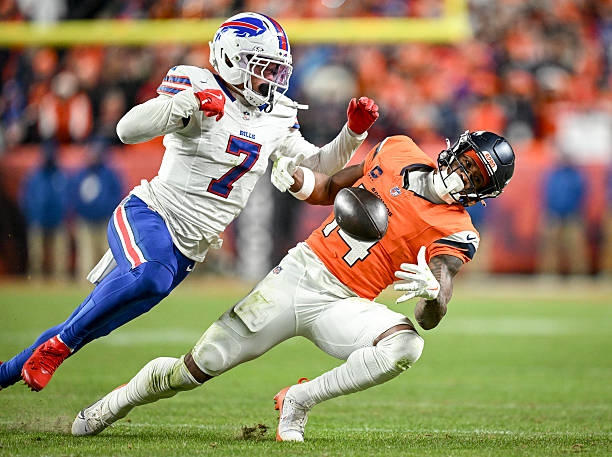Courtland Sutton of the Denver Broncos draws a key pass interference call on Taron Johnson of the Buffalo Bills during overtime of the Broncos' 33-30...