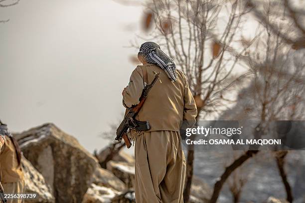 Member of the Kurdistan Democratic Party of Iran participates in a military drill in an outpost near Erbil, Kurdistan region of Iraq on January 15,...