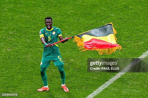 Senegal's midfielder Idrissa Gueye celebrates after the Africa Cup of Nations final football match between Senegal and Morocco at the Prince Moulay...
