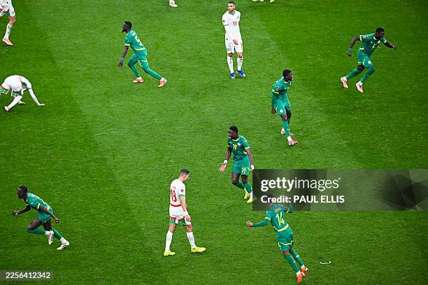 Senegal players celebrate their victory at the end of the Africa Cup of Nations final football match between Senegal and Morocco at the Prince Moulay...
