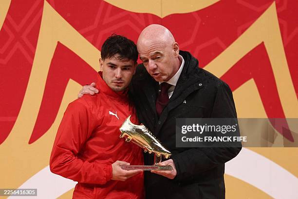 Morocco's forward Brahim Diaz receives the Golden Boot from FIFA President Gianni Infantino during presentation at the end of the Africa Cup of...