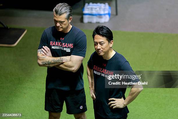 Secretary of War Pete Hegseth and Japanese Defense Minister Shinjirō Koizumi prepare for their workout on January 15, 2026 in Joint Base...