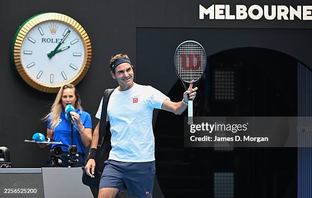 Roger Federer of Switzerland waves to the crowd on Rod Laver Arena as he enters for a practice session ahead of the 2026 Australian Open at Melbourne...