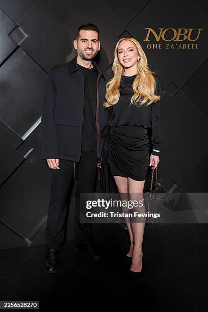 Bader Shammas and Lindsay Lohan walk the red carpet at the Nobu One Za'abeel Opening Night at the One & Only One Za'beel on January 15, 2026 in...
