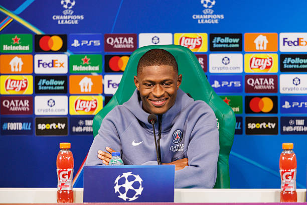 Nuno Mendes talks during the Paris Saint-Germain Training Session and Press Conference at Estadio Jose Alvalade on January 19, 2026 in Lisbon,...