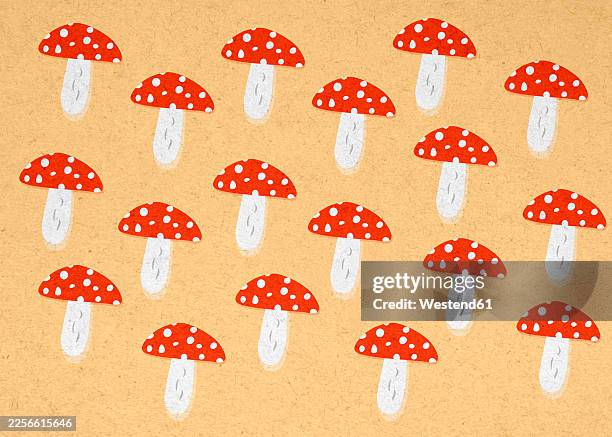 red and white spotted mushroom pattern illustration on textured background - white studio background stock illustrations