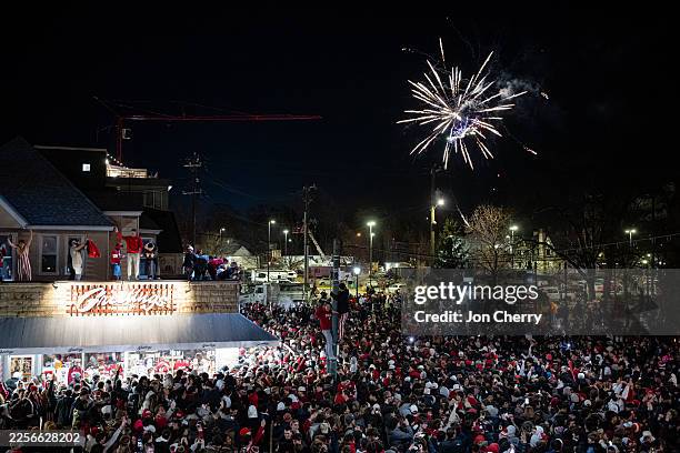 Fireworks go off as Indiana University fans celebrate in the downtown streets after the College Football Playoff national championship game between...