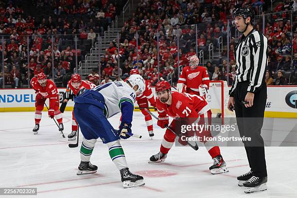 Detroit Red Wings forward Dylan Larkin looks on before face-off with Vancouver Canucks forward Elias Pettersson during the third period of a regular...