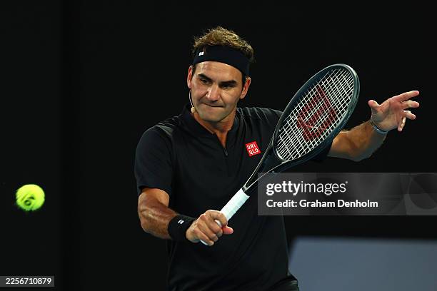 Roger Federer of Switzerland plays a backhand during the Opening Ceremony exhibition match ahead of the 2026 Australian Open at Melbourne Park on...