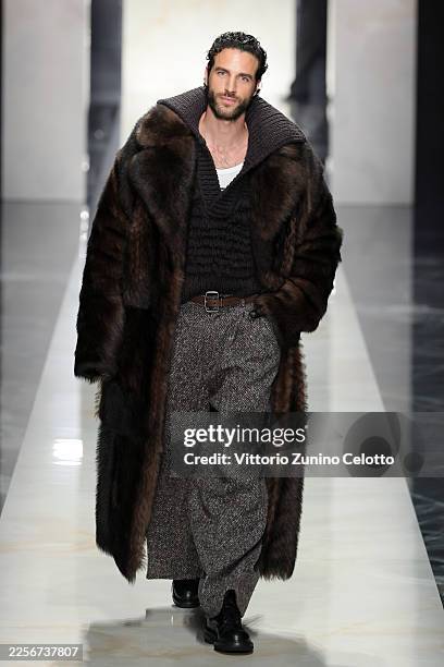 Model walks the runway at the Dolce & Gabbana fashion show during the Milan Fashion Week - Menswear Fall/Winter 2026-2027 on January 17, 2026 in...